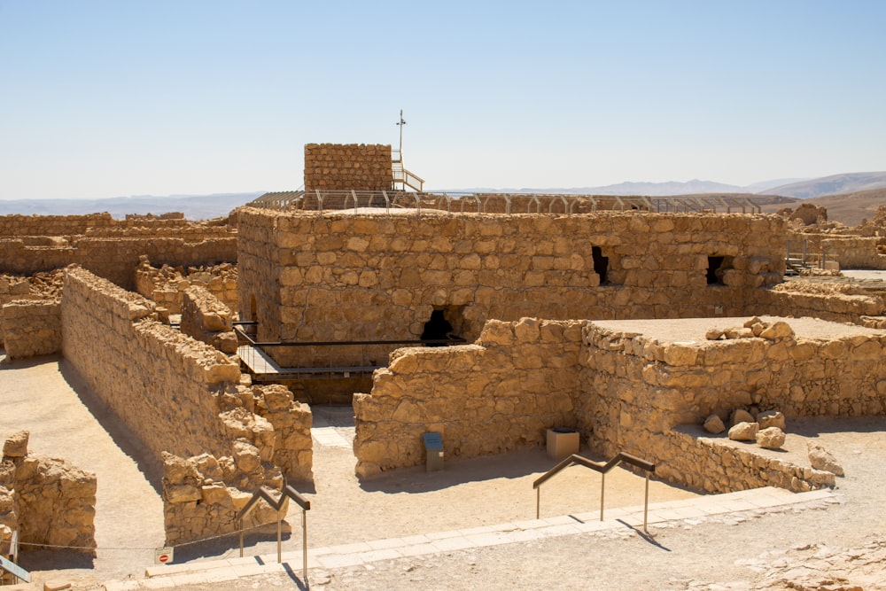 a stone building in the middle of a desert