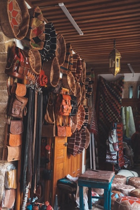 Elegant Moroccan leather bags displayed on a rustic wooden table