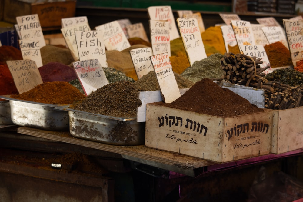 a variety of spices on display at a market