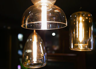 Elegant pendant lighting casting warm light over a minimalist room.