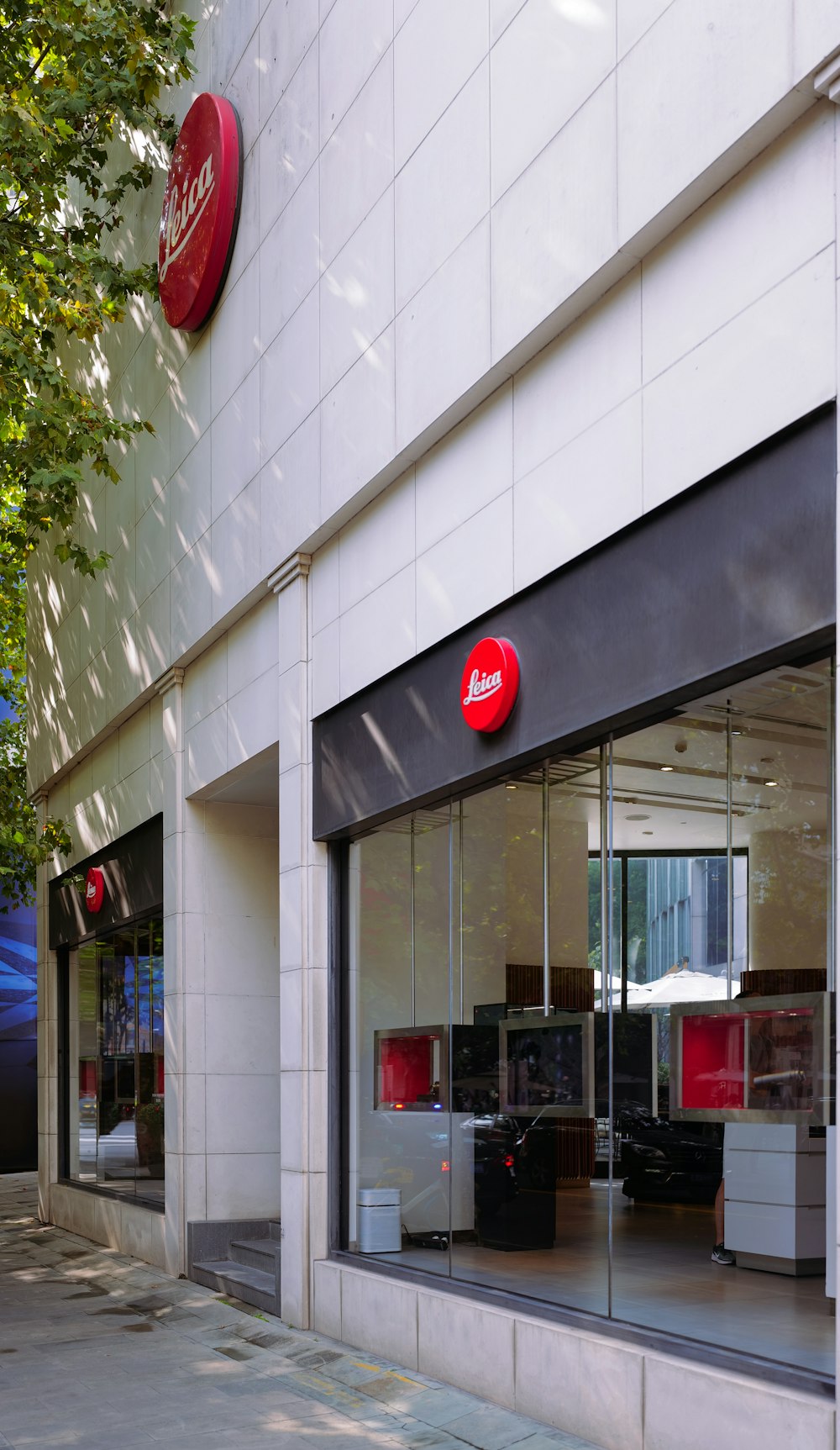 a storefront with a red sign on the front of it