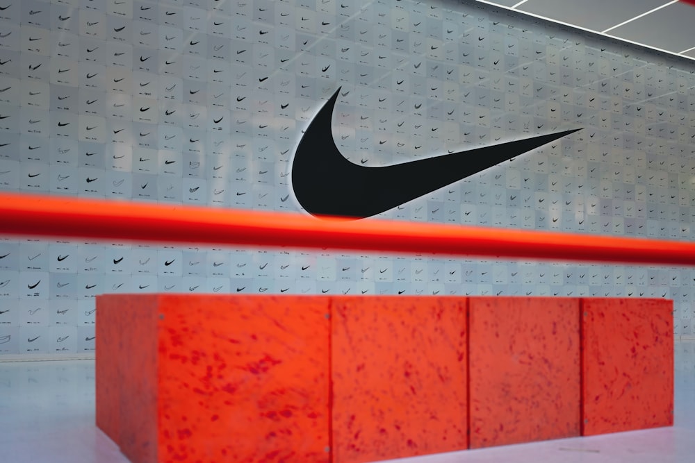 a nike logo on a wall in a building