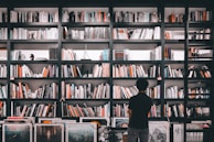 Bookshelf filled with legal books and awards in the office.