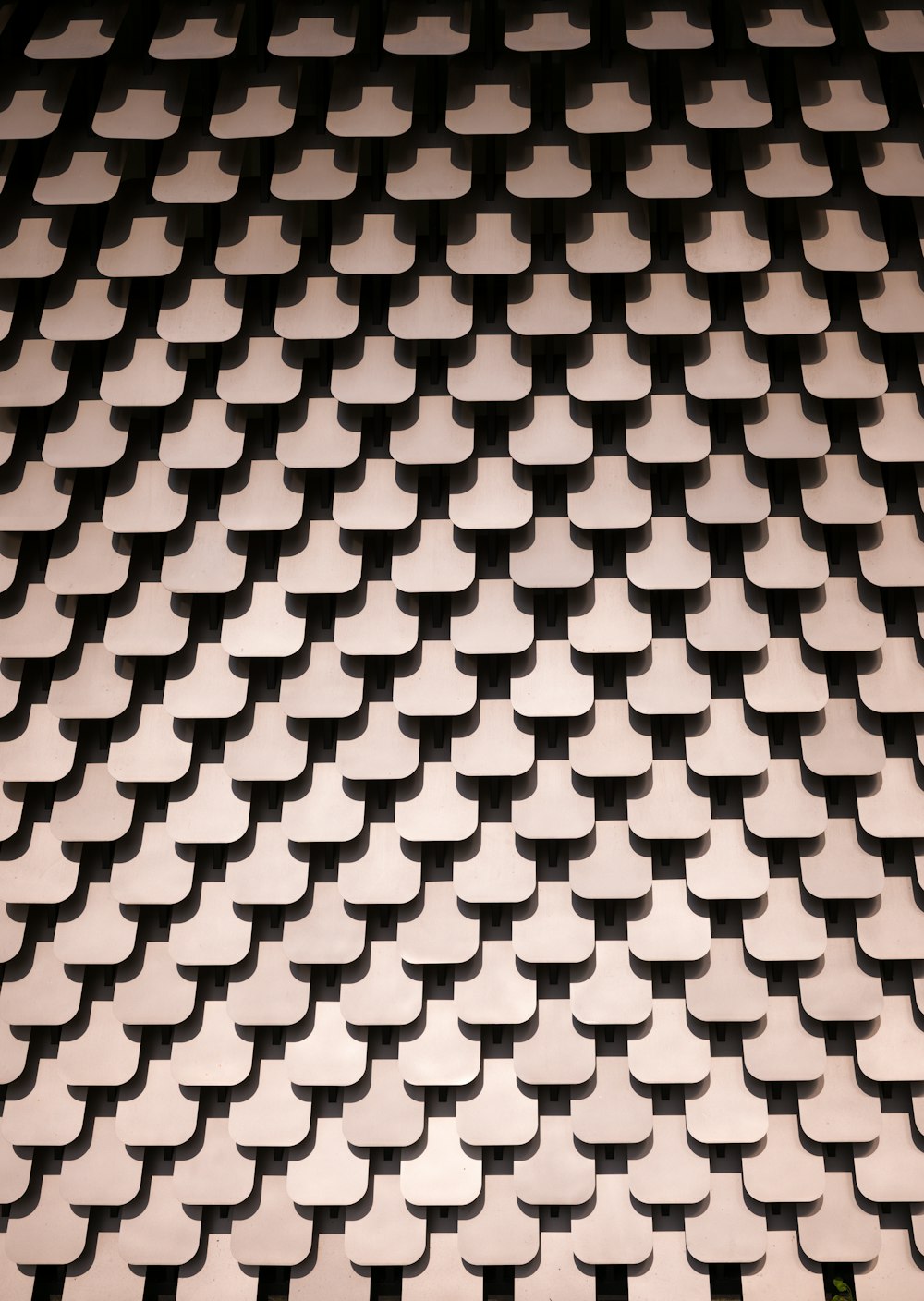 a black and white photo of a pattern on a wall
