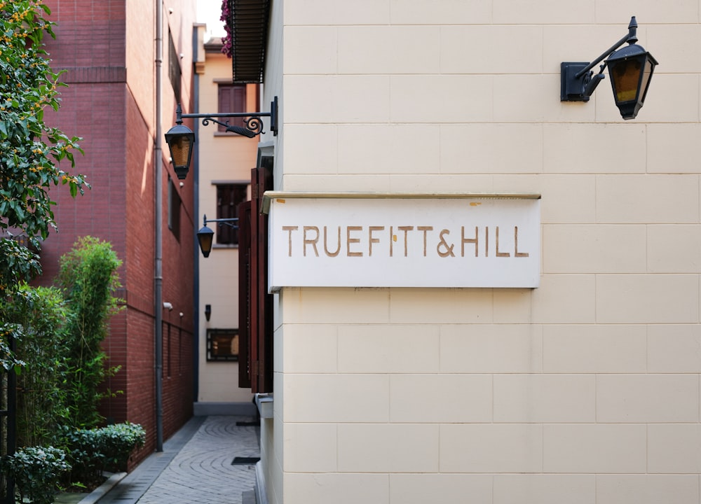 a sign on the side of a building that says truett and hill