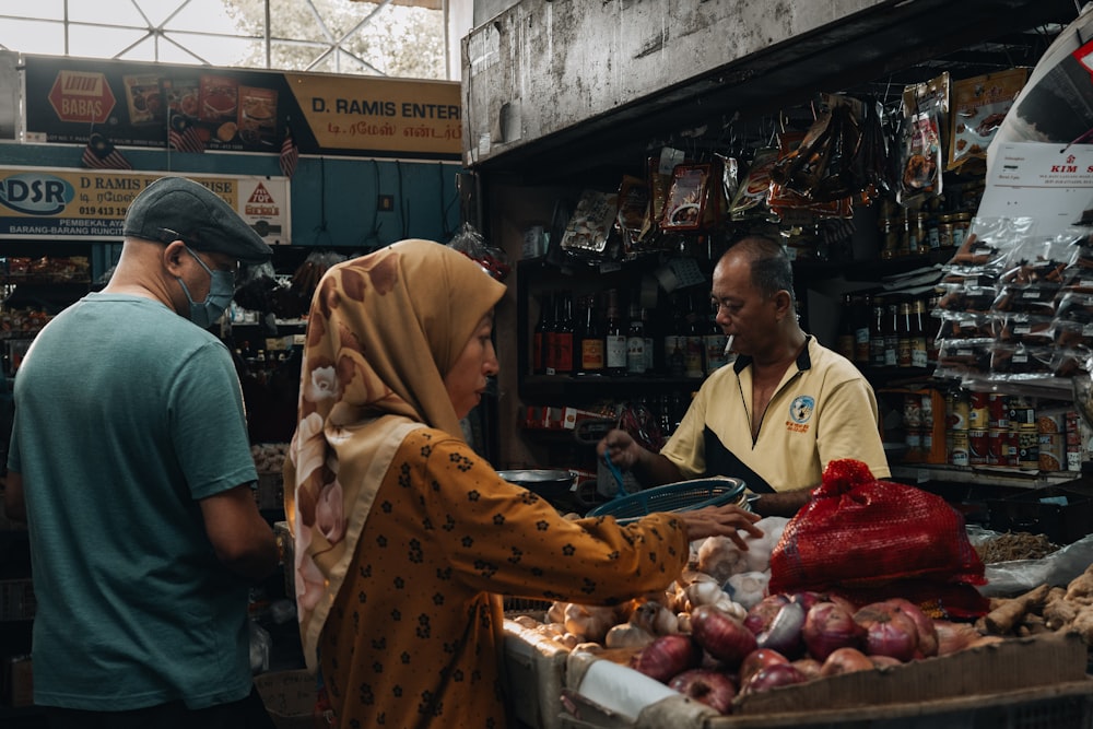 a group of people standing around a market