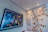 Close-up of a framed urban jazz cityscape print glowing under soft gallery lighting.