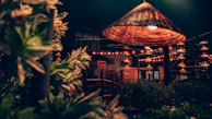 Evening ambiance of the hotel’s courtyard illuminated with soft lanterns.