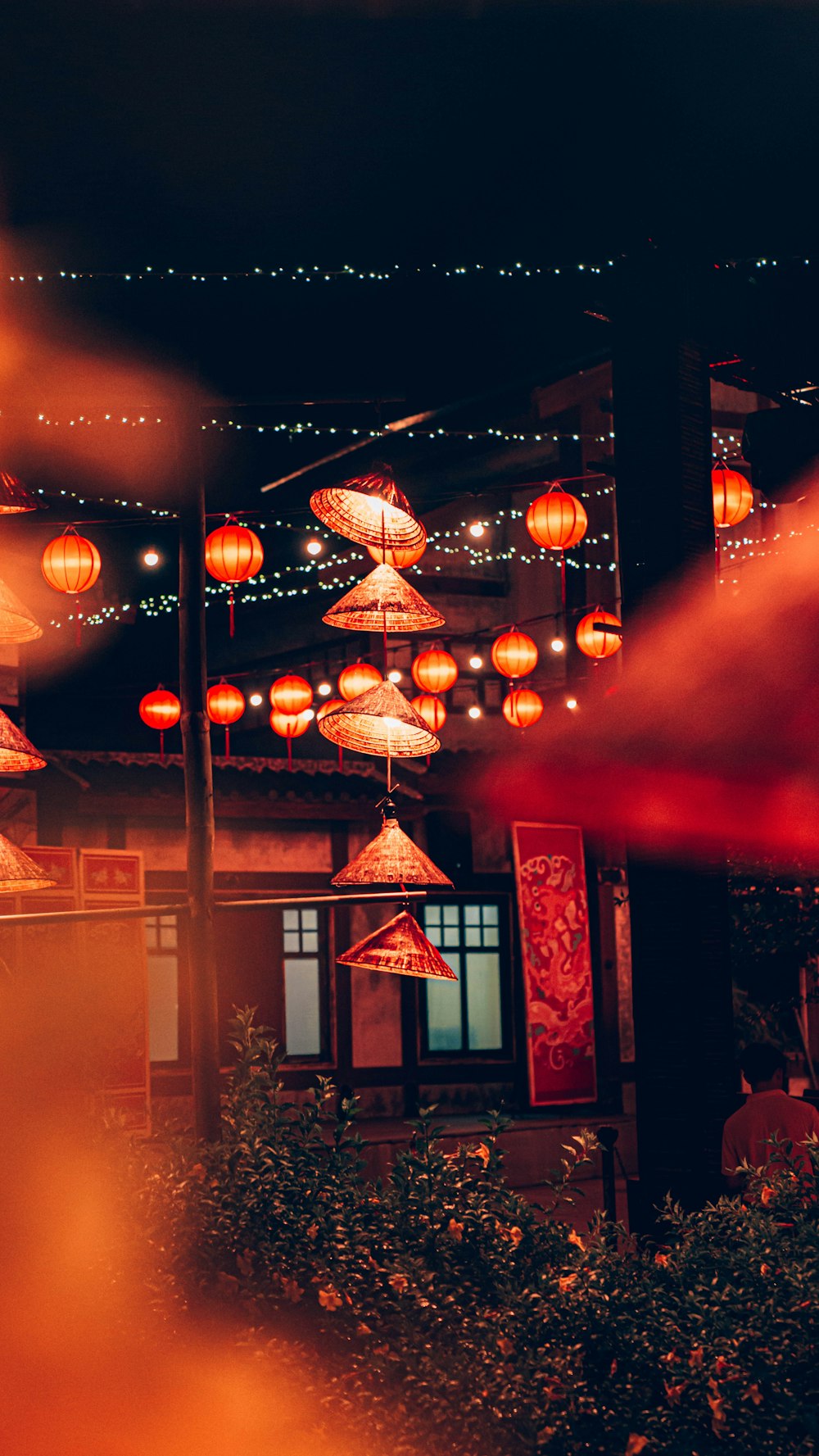 a group of red lanterns hanging from the ceiling