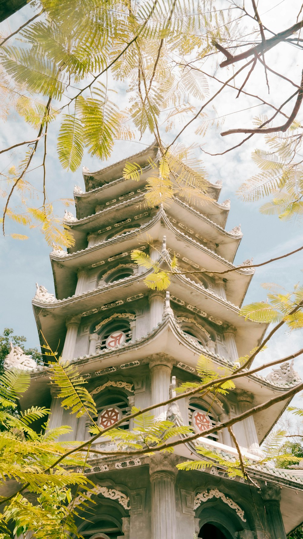 a tall tower with a clock on the top of it