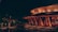 A serene rooftop dining setup overlooking the Ganges with traditional Indian decor and soft lighting.