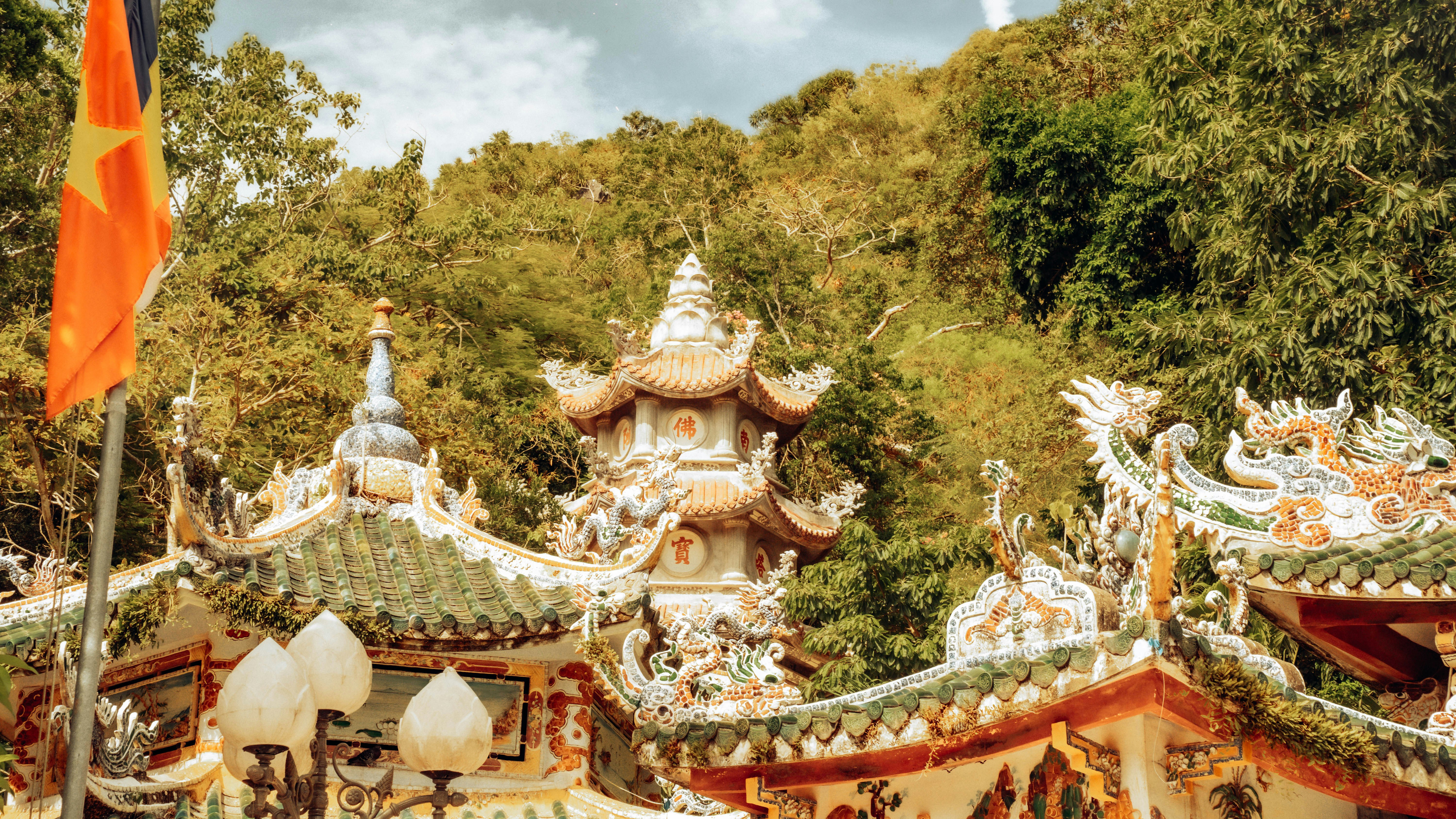 a group of buildings with a flag flying in front of them