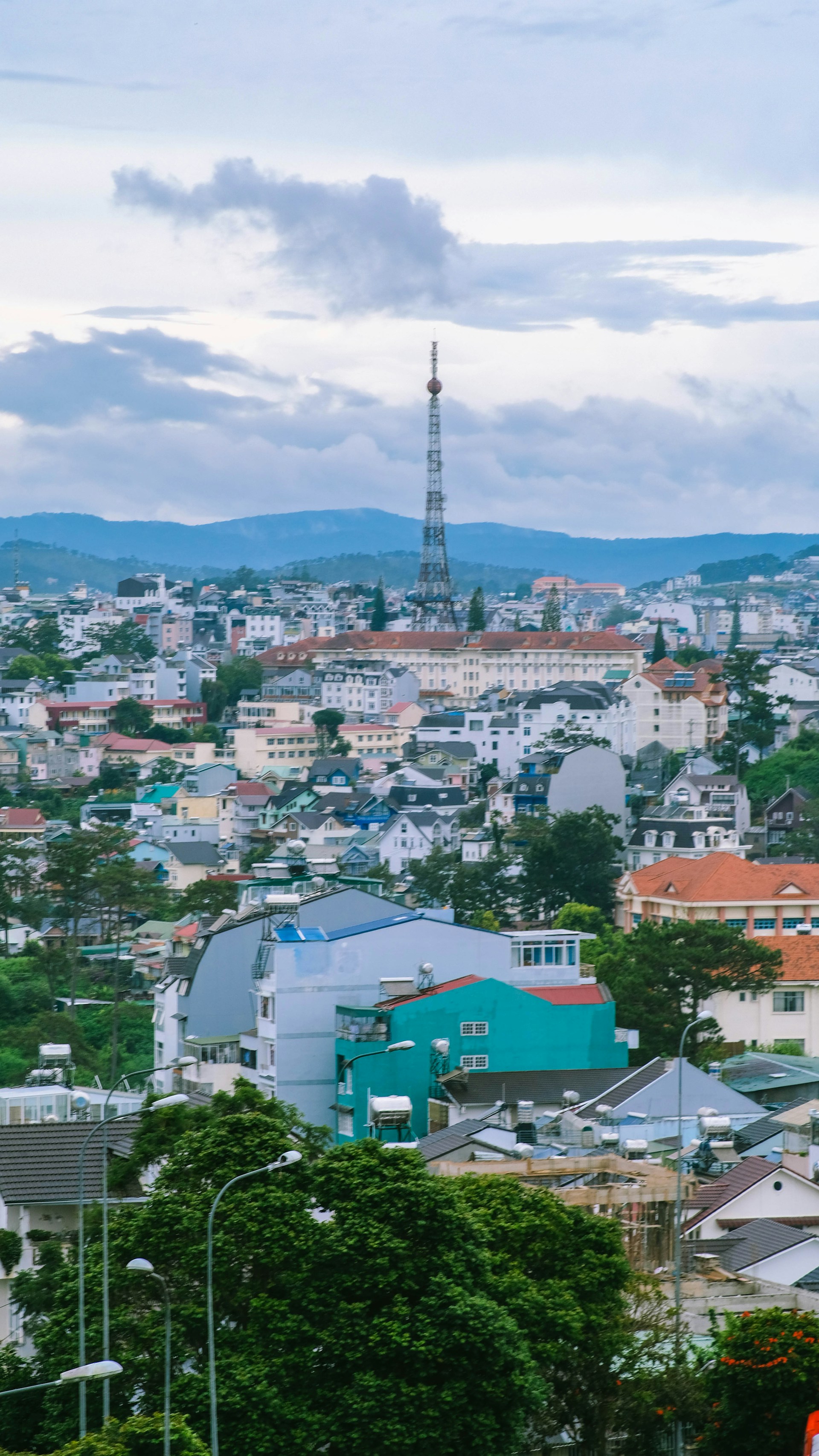 woman wearing yellow long-sleeved dress under white clouds and blue sky during daytime