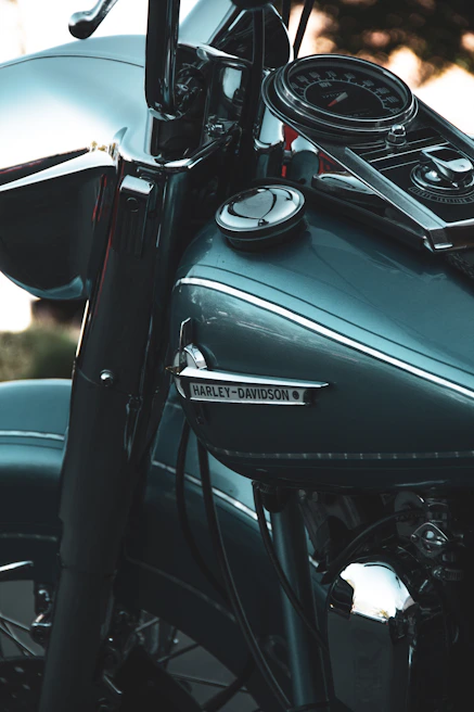 Close-up of custom handlebars and internal wiring showcasing meticulous craftsmanship on a Harley build.