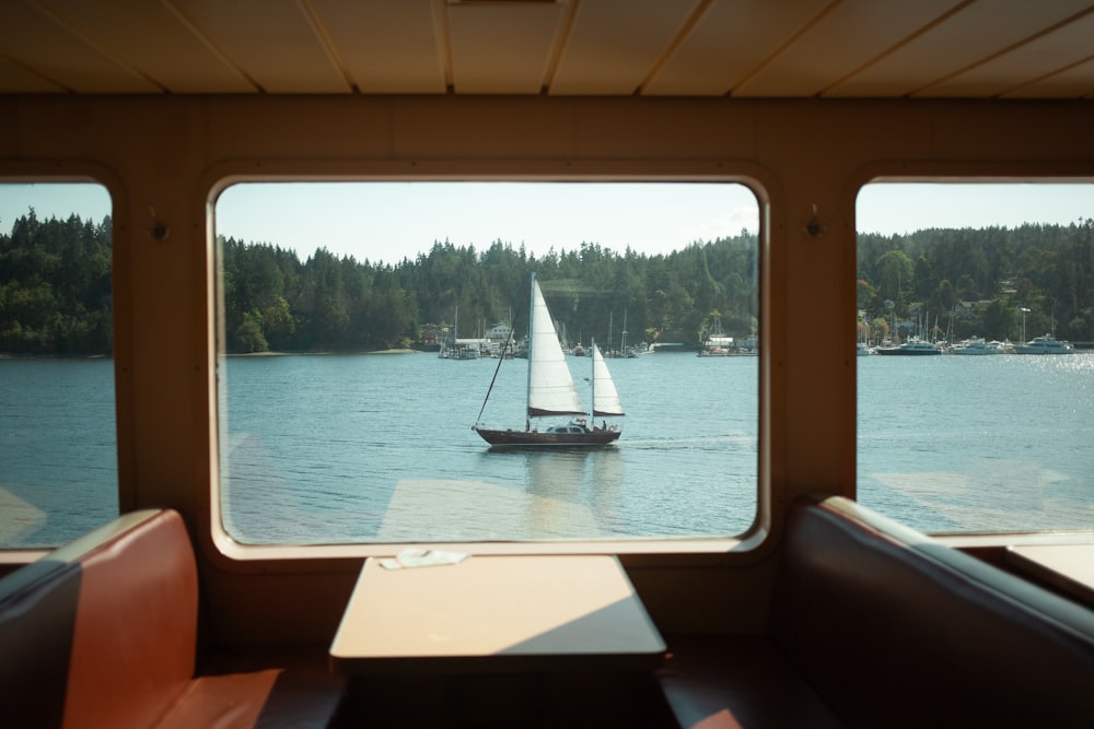 a view of a sailboat out of a window