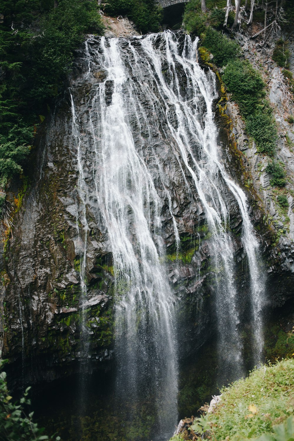 a large waterfall with lots of water coming out of it