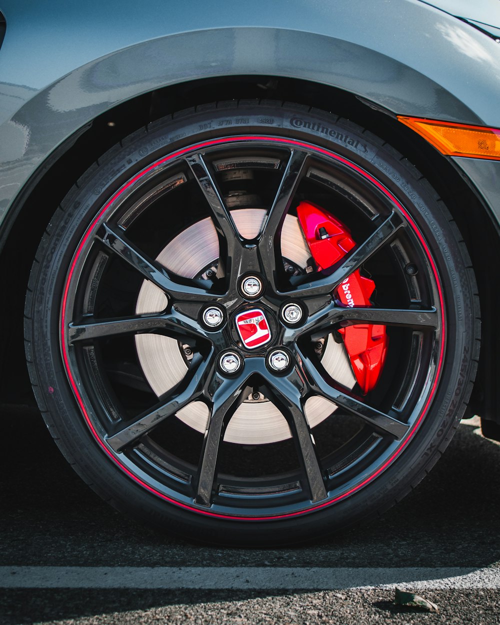 a close up of a tire on a sports car