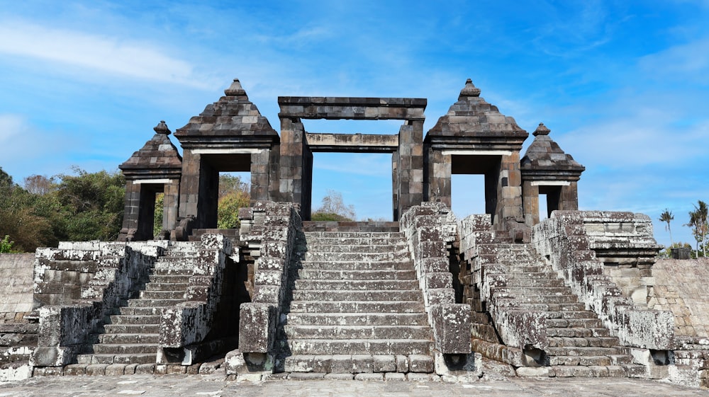 a stone structure with steps leading up to it