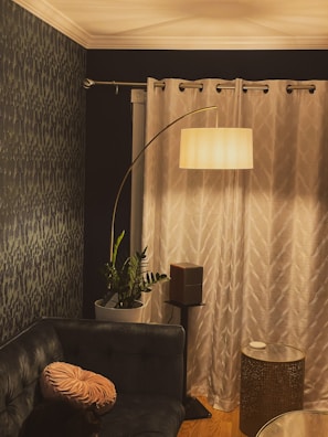 Cozy living room corner with warm lighting and trendy decor accents.