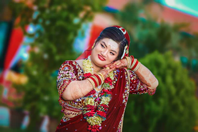 A graceful lady posing in a colorful traditional Thai dress