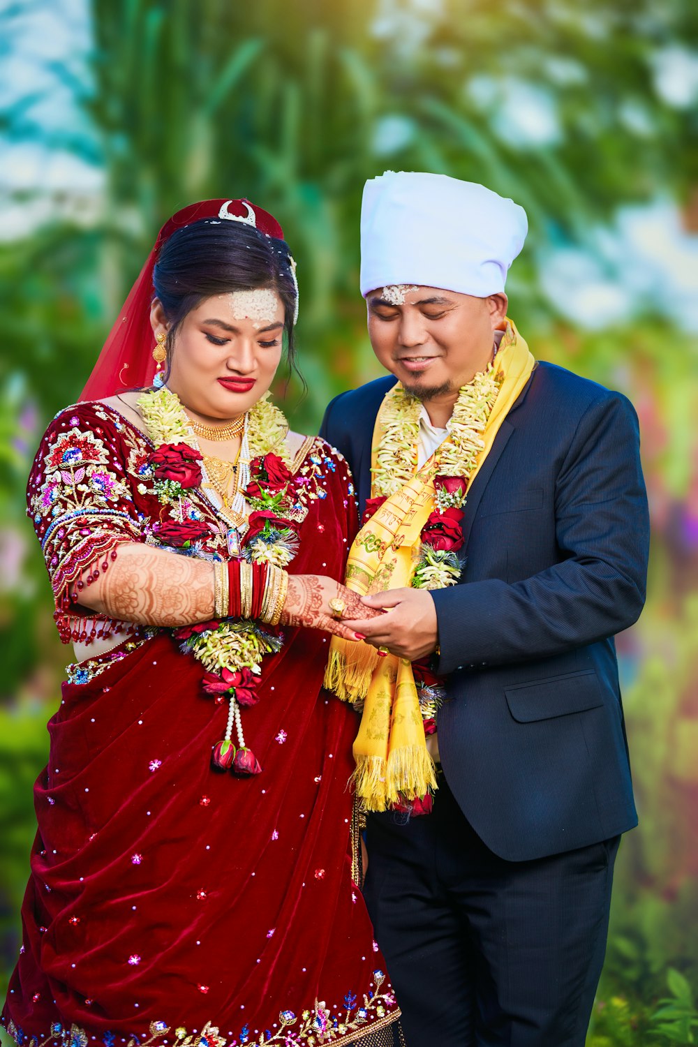 a man and woman dressed in traditional indian garb