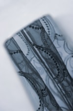 Close-up of delicate lace fabric and vintage jewelry used as props in a boudoir session.