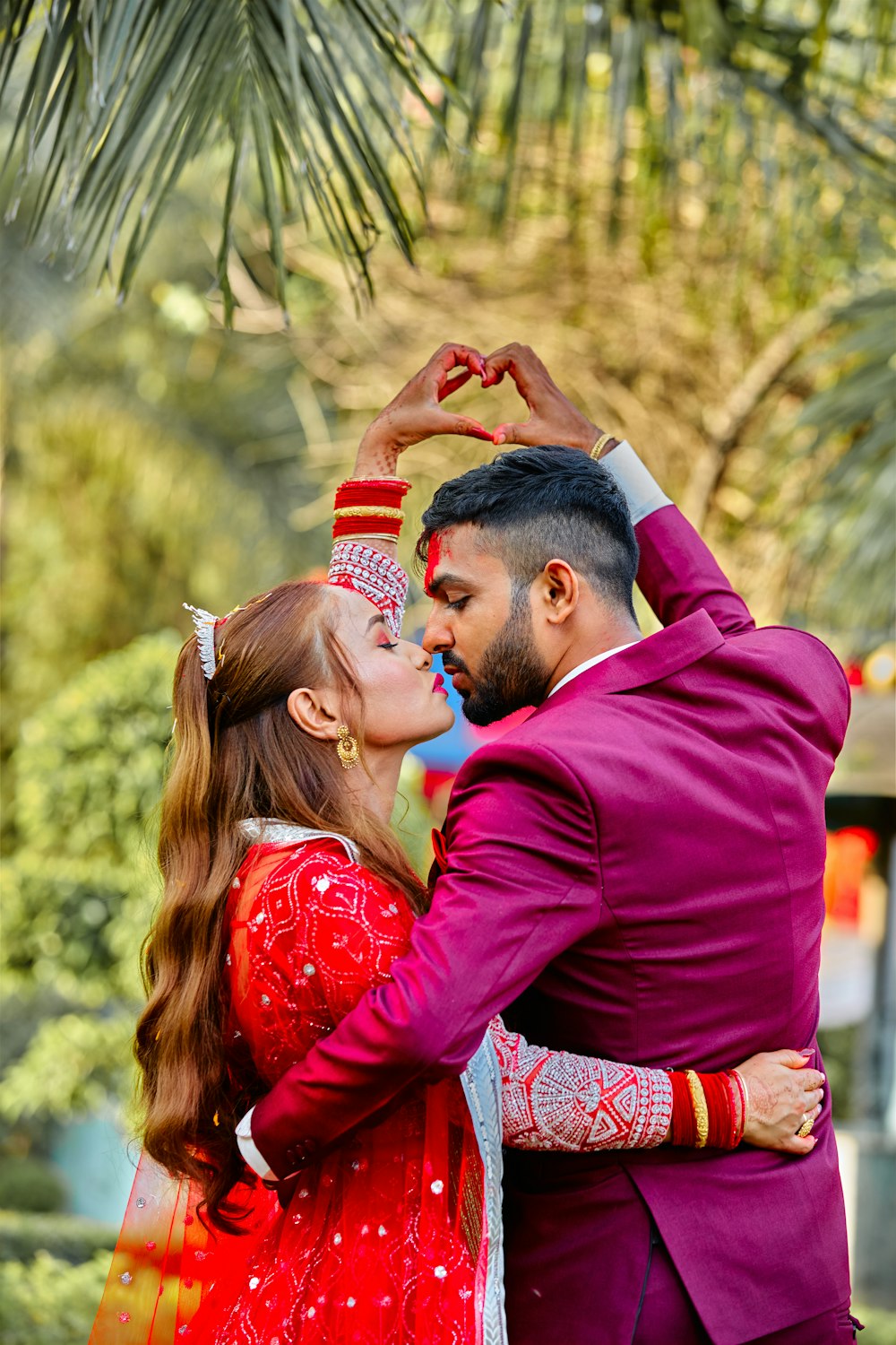 a man and a woman are dressed in red