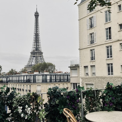 A luxurious Parisian apartment with elegant decor and a view of the Eiffel Tower.