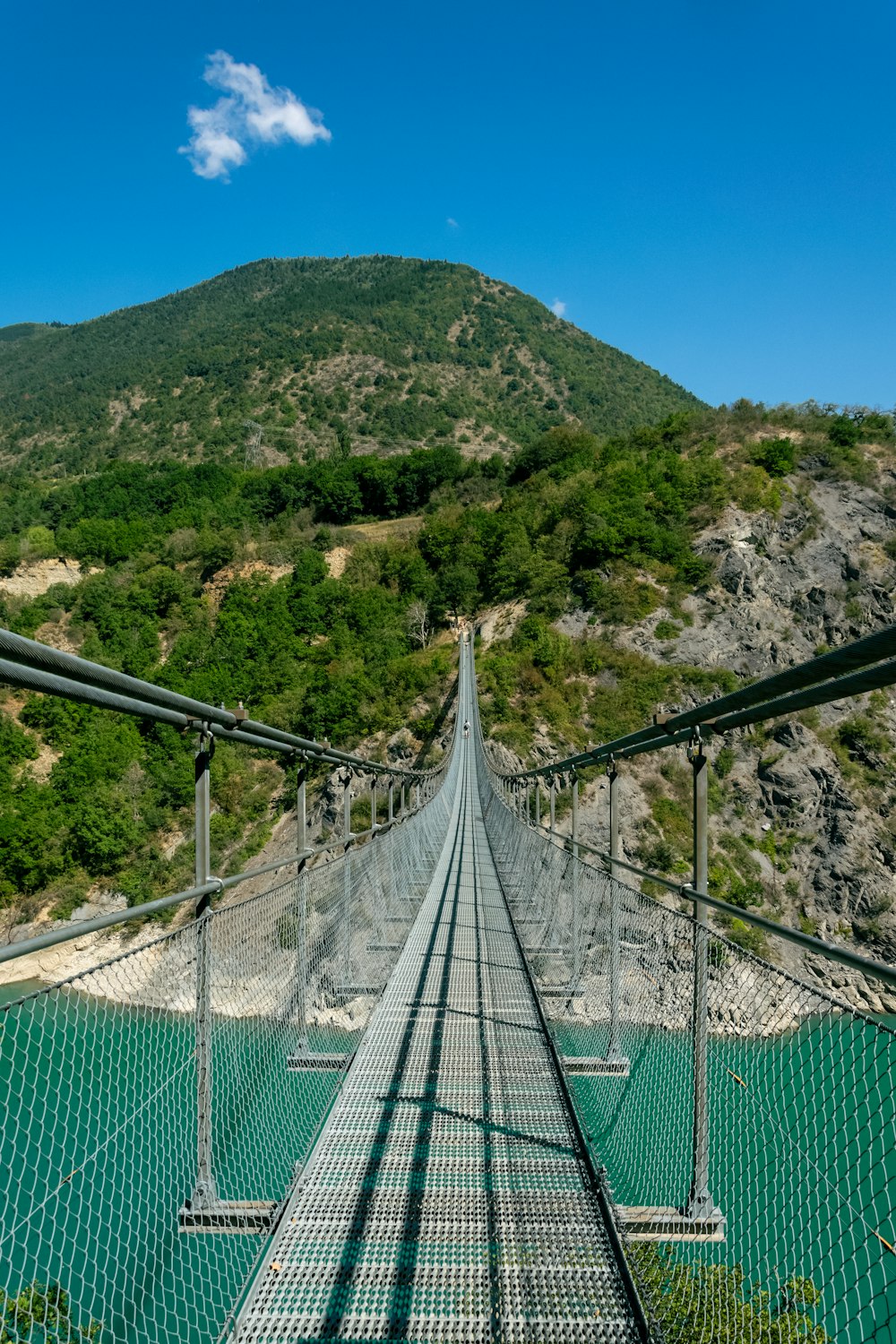 a suspension bridge over a body of water