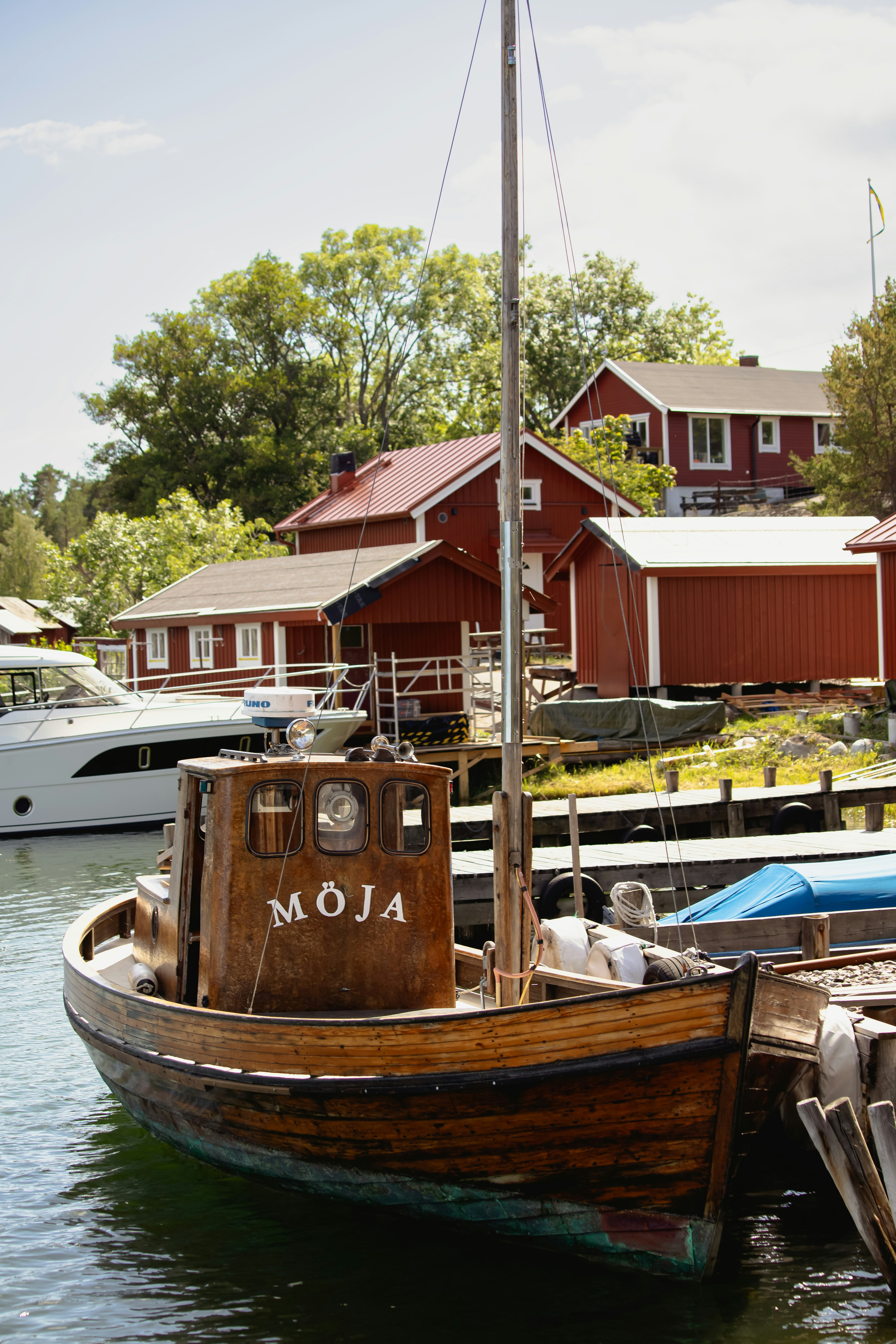 a boat is docked in the water next to a dock