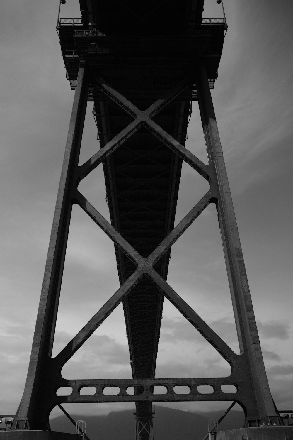 a black and white photo of a bridge