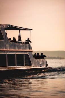 Boat transporting guests between Agatti Island and 4h lakshadweep resort at sunrise.