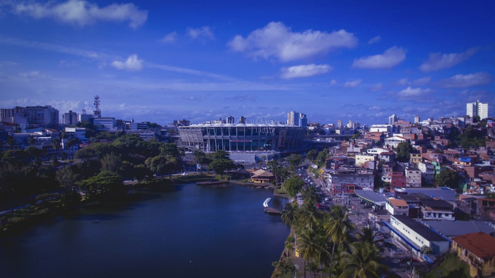 a view of a city with a lake in the foreground