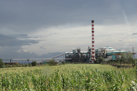 a factory with a large pipe sticking out of it's side