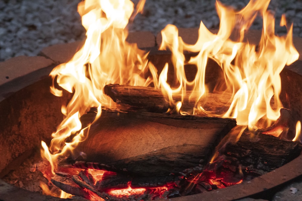 a close up of a fire pit with flames