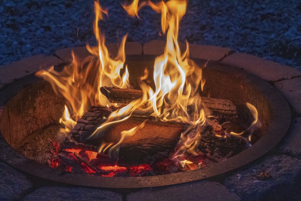 a fire pit with a bunch of fire coming out of it