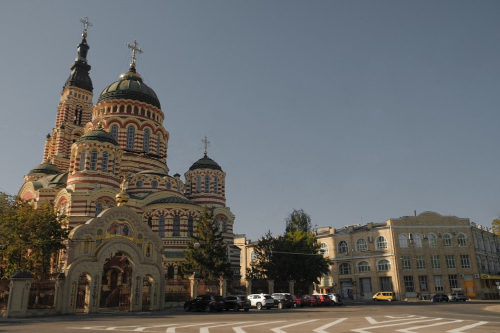 a large church with two towers and a cross on top of it