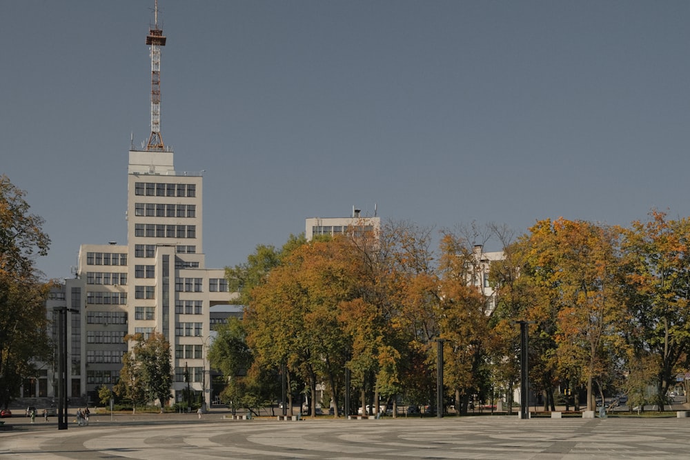 a city street with tall buildings in the background