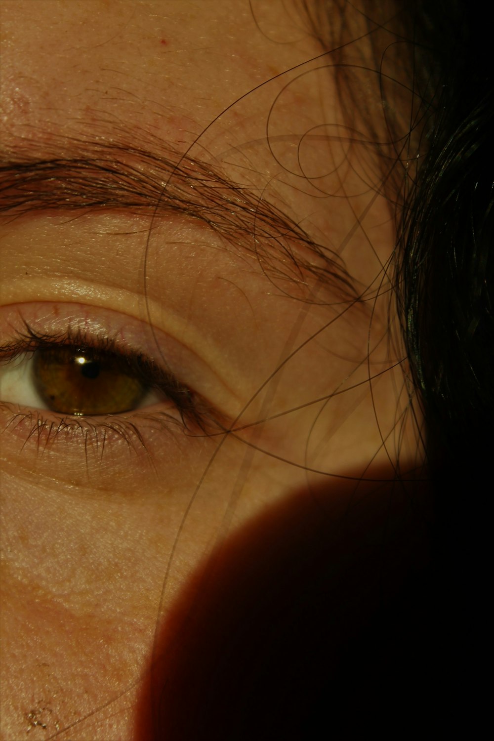 a close up of a person with brown eyes