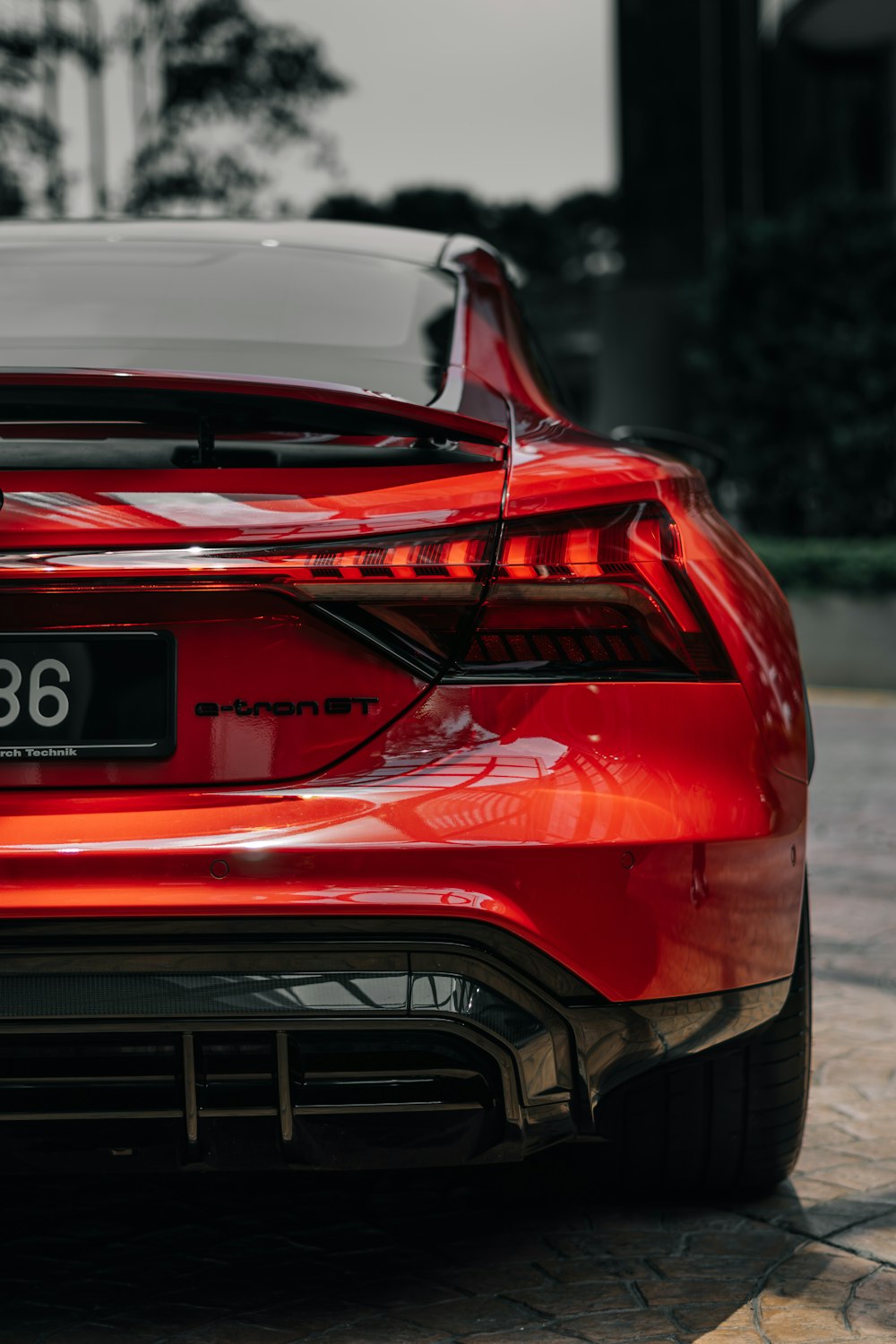 the back end of a red sports car