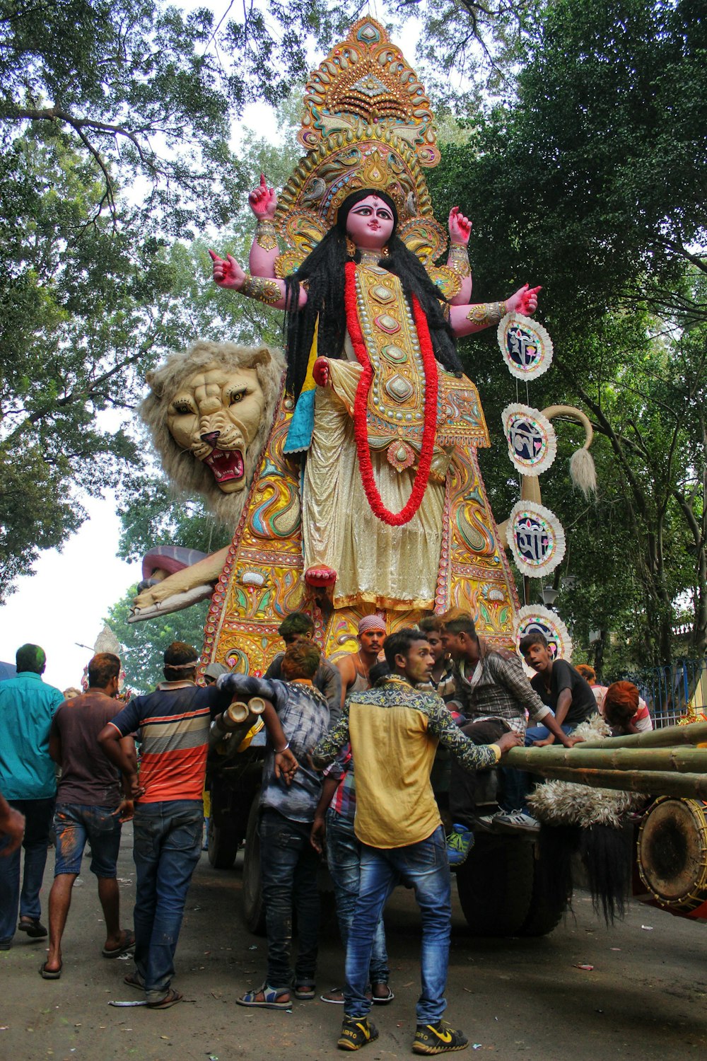 a group of people standing around a statue