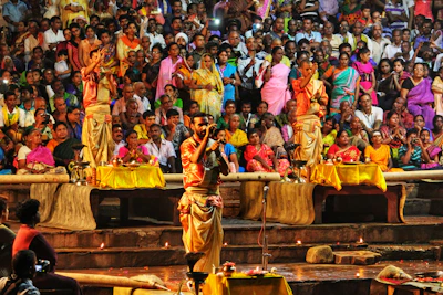 A vibrant community gathering at Banjar Hitakarma celebrating a traditional Hindu ceremony