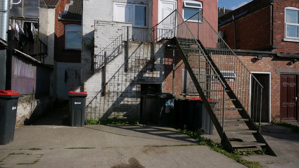 a set of stairs leading up to a brick building