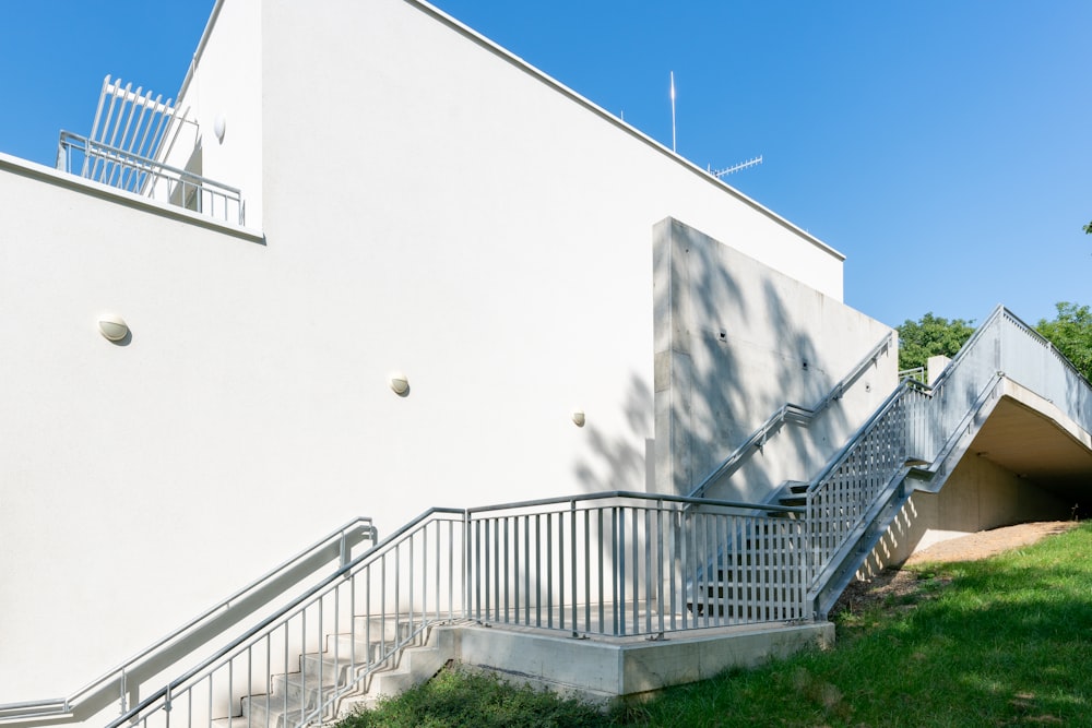 a white building with stairs leading up to it