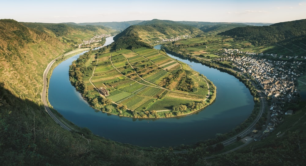 a river running through a lush green valley