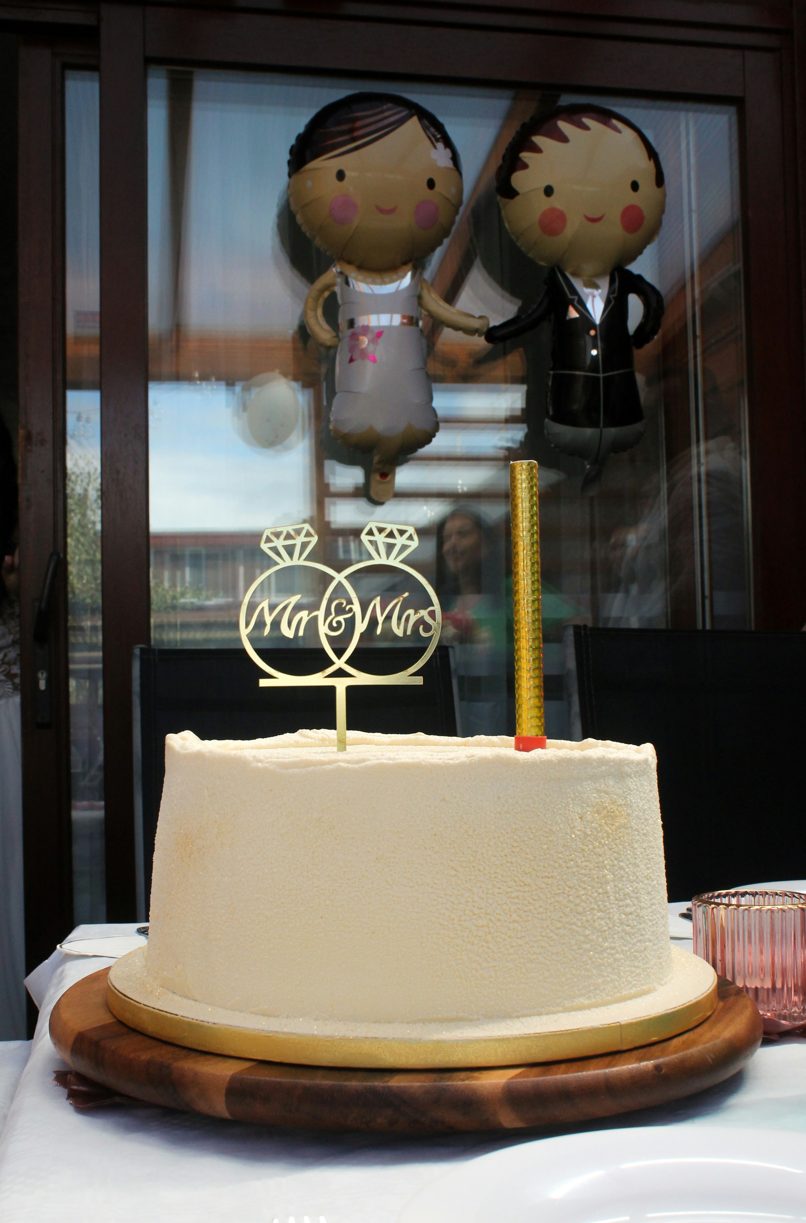 a cake with a couple on top of it