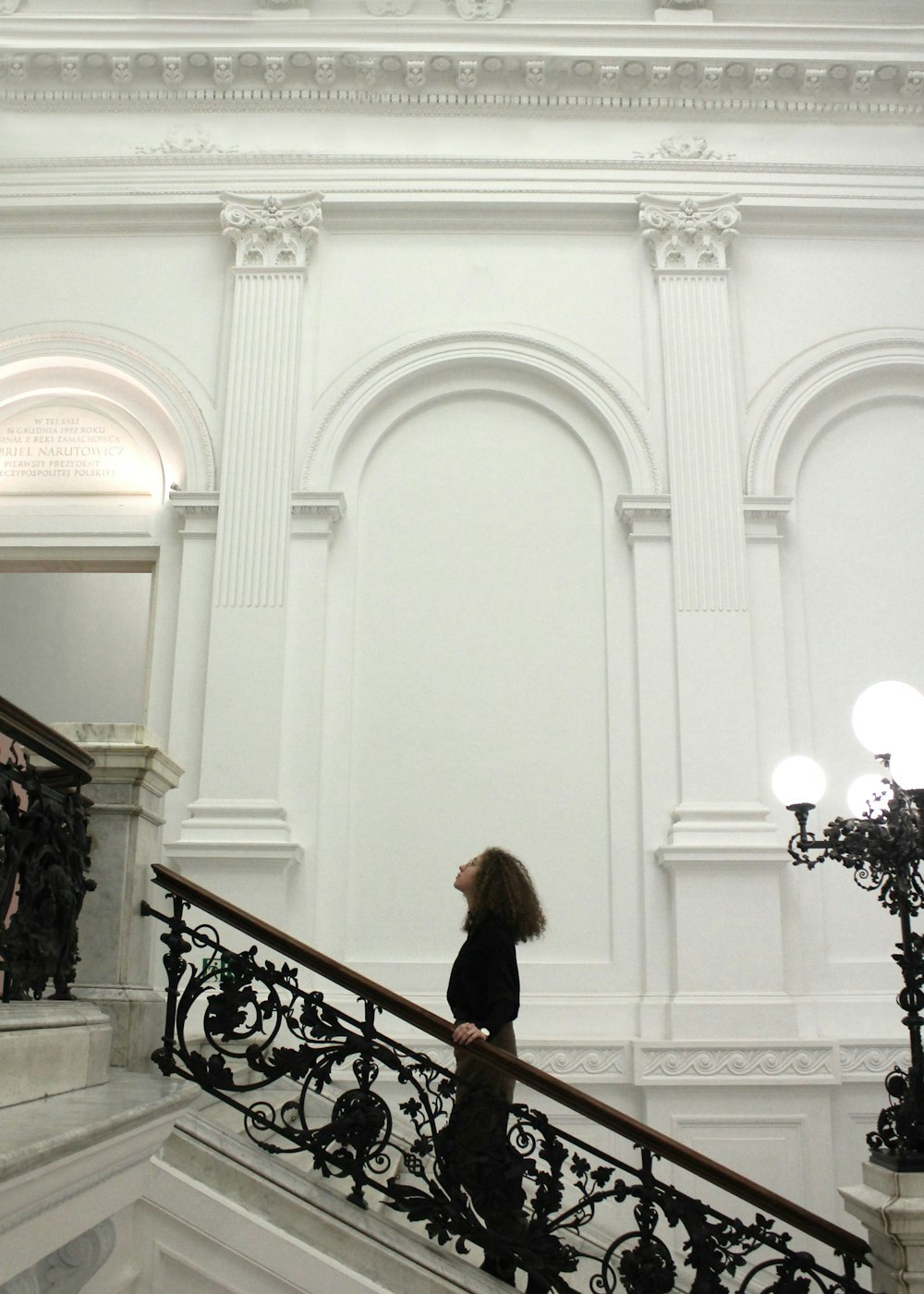 a woman walking down a set of stairs