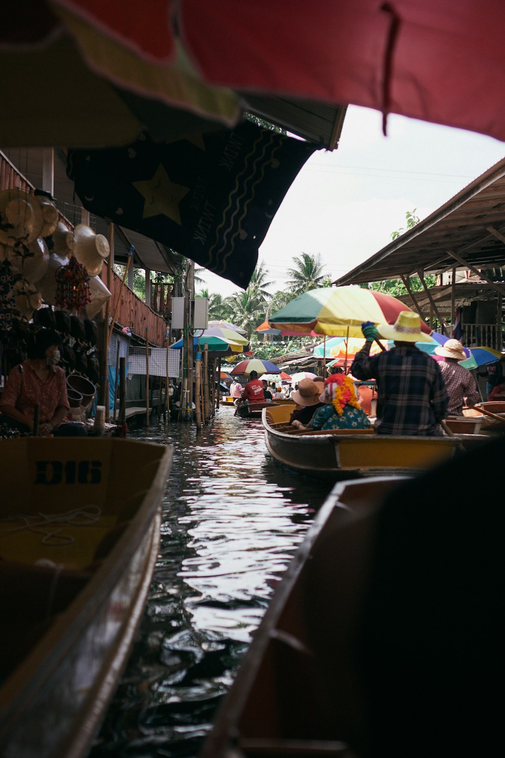 a group of people riding in a boat down a river