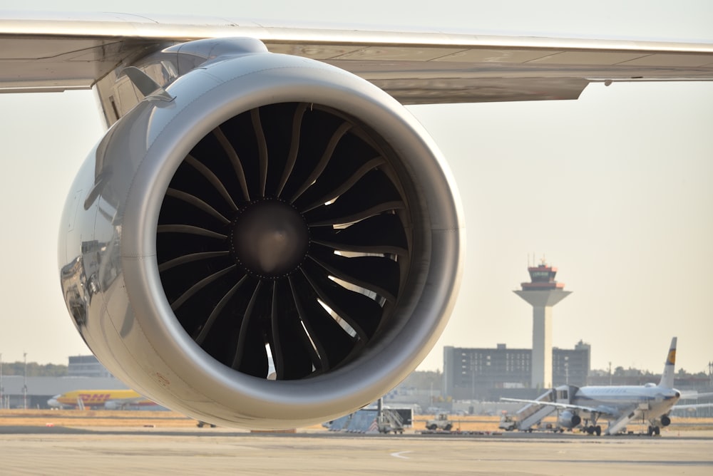 a large jet engine sitting on top of an airport tarmac