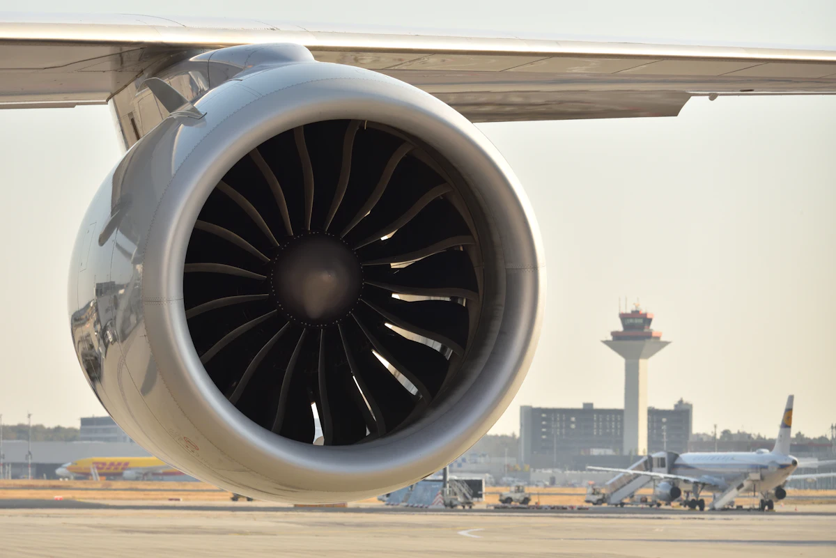 Jet engine under inspection on the tarmac